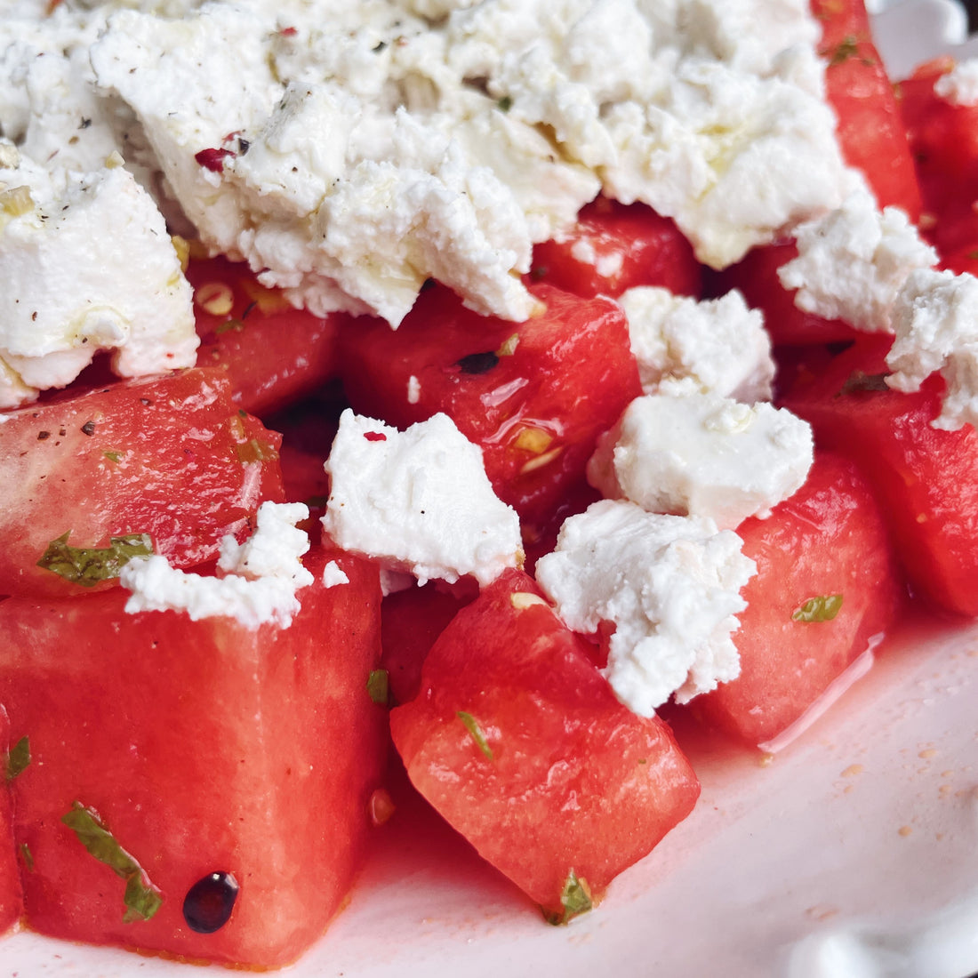 Juicy watermelon sprinkled with mint and Kinda Co Greek Style cheese