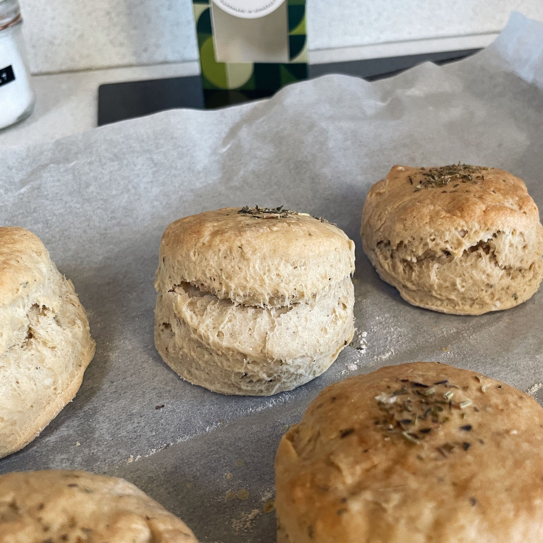 Freshly baked cheesy scones topped with mixed herbs.